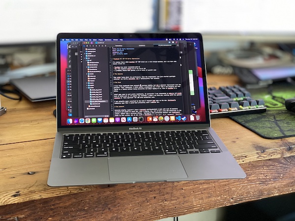 2020 M1 Macbook Air on wooden desk